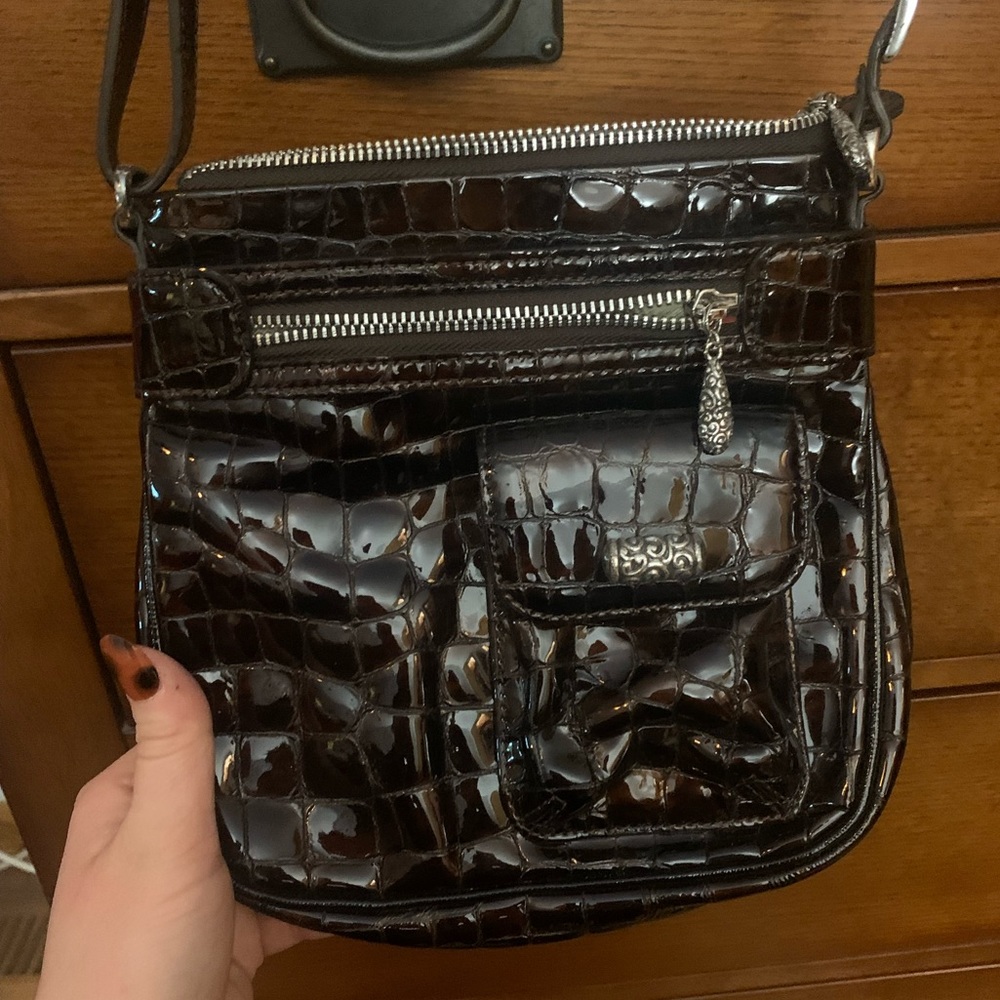 Over the shoulder, croc texture leather Brighton bag. Adjustable shoulder strap.